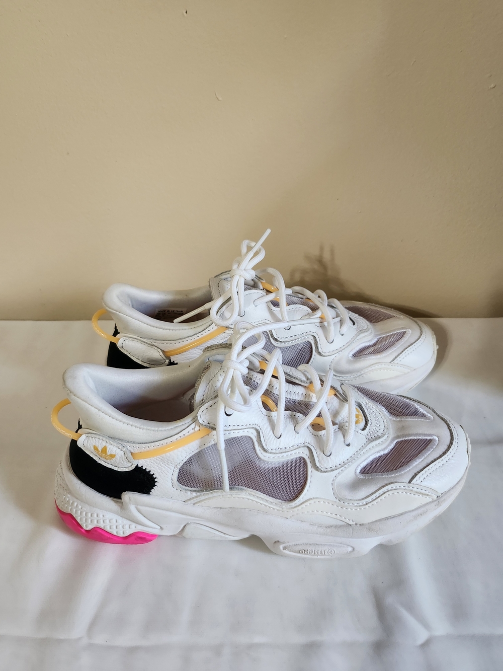 adidas White Sneakers with Yellow Accents and Pink Outsole